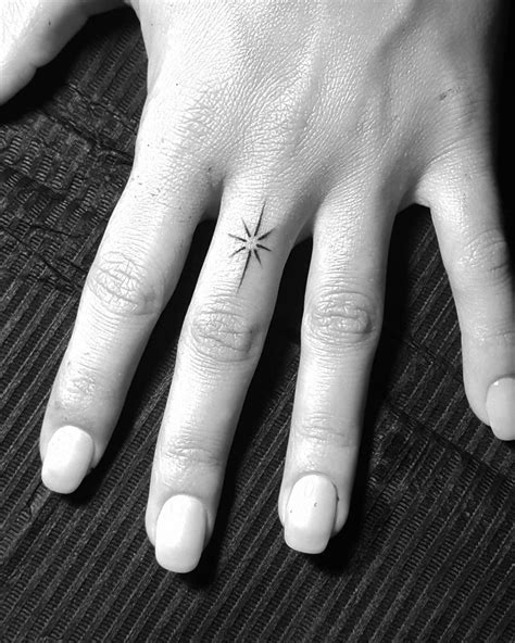 star finger tattoo